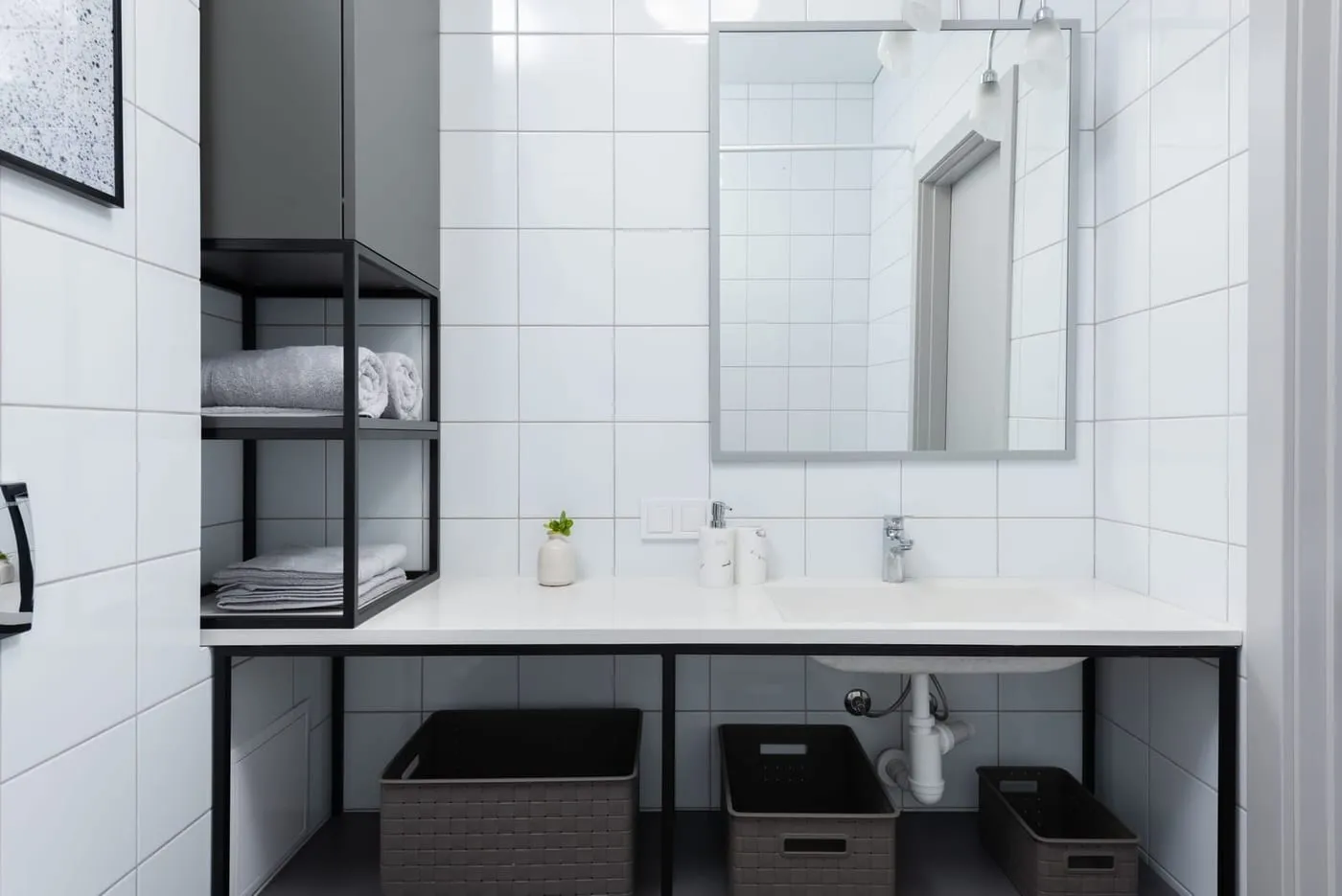 Storage baskets on a shelf keeping utility clutter contained